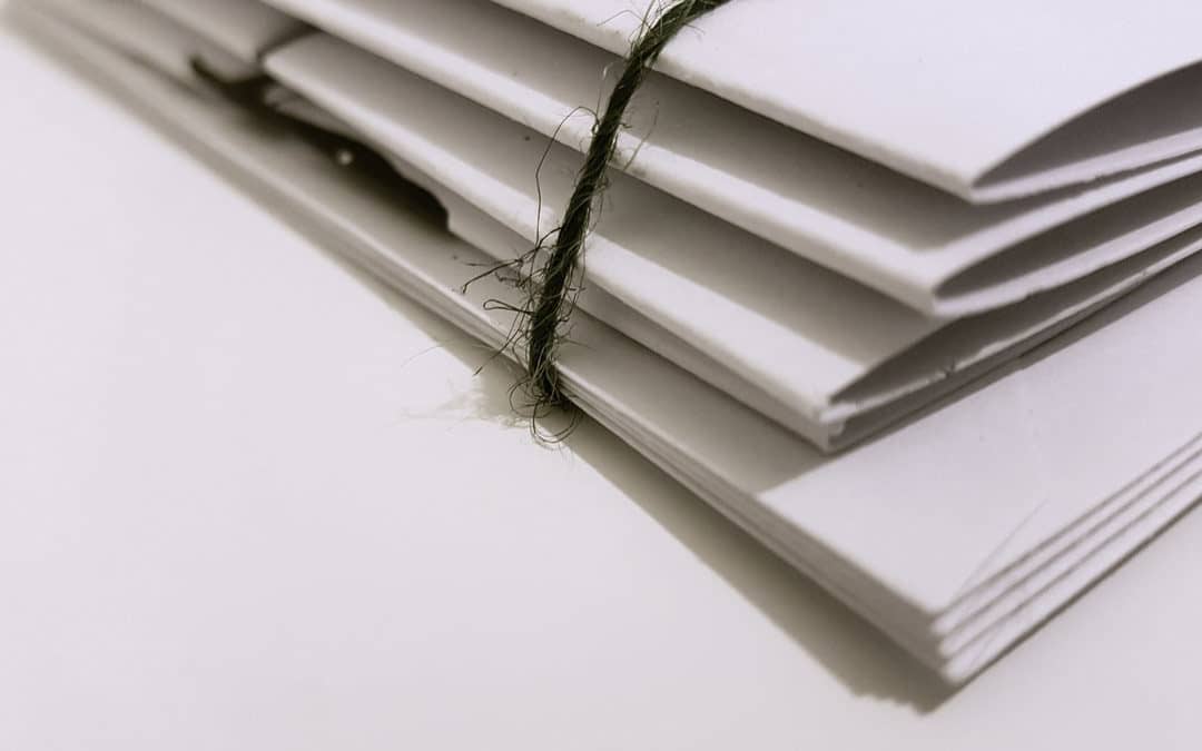 Stack of papers bound with twine