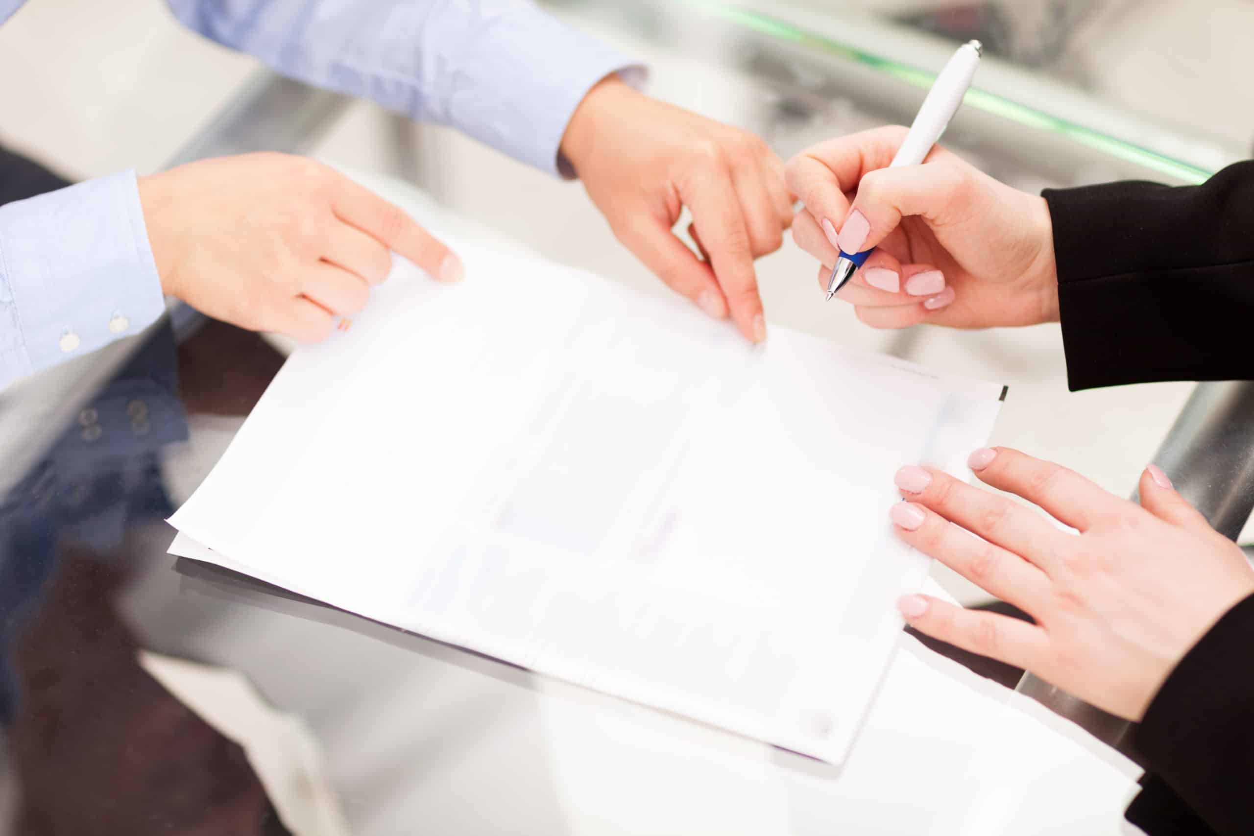 shutterstock_266863583 People signing papers