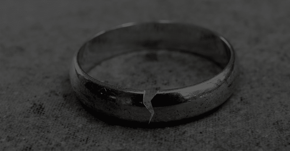 A broken wedding ring on the ground